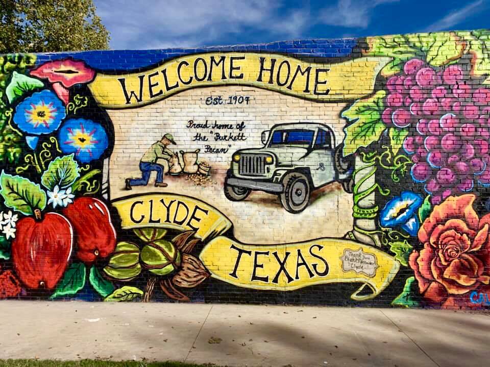 Community mural and local character in Clyde, Texas